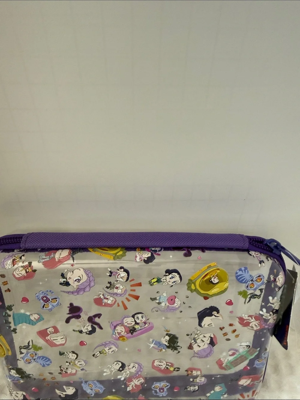 Netflix K-POP Demon Hunters Chibi-Style Clear PVC Pencil Case with Purple Trim.